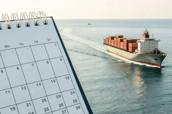 A calendar and a cargo ship indicating transit time from China to Australia