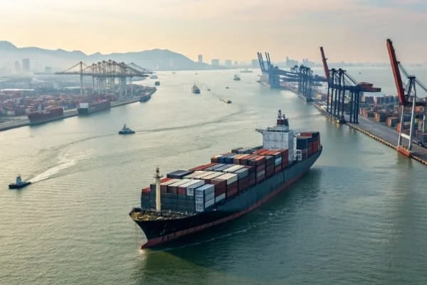 A cargo ship waiting outside a congested port