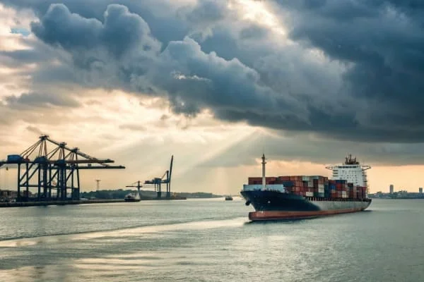 A cargo ship with containers sailing towards Hamad Port in Qatar