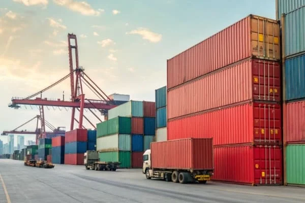 Shipping containers at a port, representing shipping from China to Canada