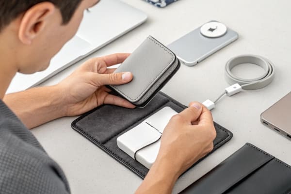 A person inspecting the quality of a MagSafe compatible wallet