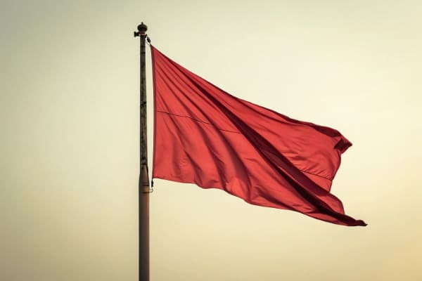 a red flag on a pole
