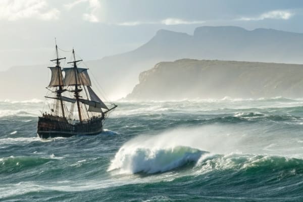 A ship sailing in rough seas around the Cape of Good Hope